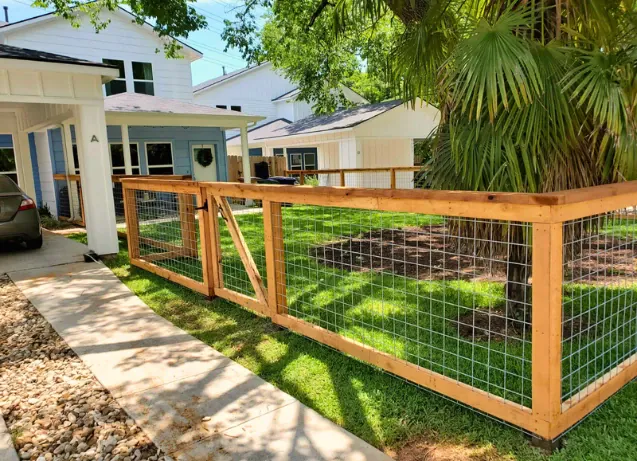 fence-installation-contractor Installed bull panel fence creating a rustic look