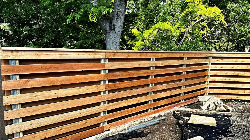 Newly repaired shadowbox fence providing a refreshed look