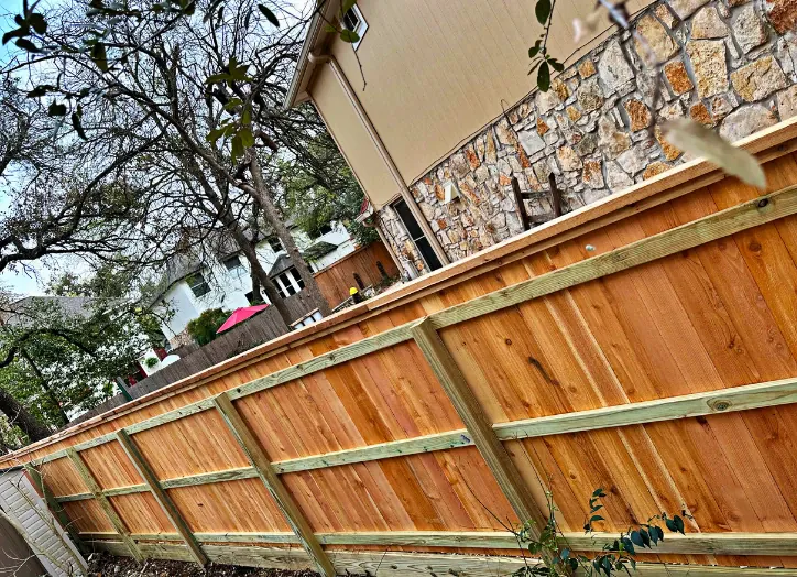 fence-repair-contractor-cedar-park Backyard fence providing privacy and a clean property boundary