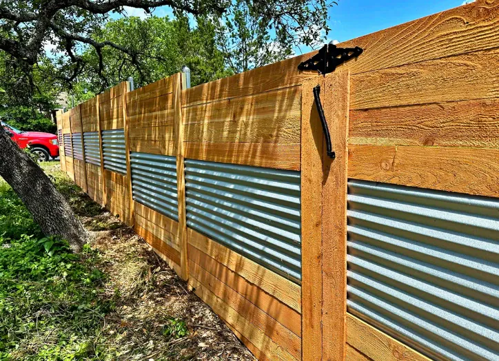 fence-repair-contractor Fence with corrugated steel in the middle for a modern industrial look